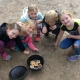 Students making damper in a camp oven on a Present and Past Family Life program