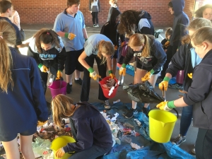 students running a waste audit