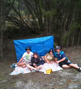 students with their shelter in bushcraft survival