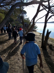 students walking around lake