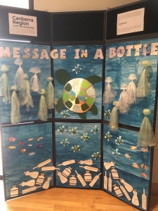 artwork showing students message in a bottle about plastic pollution